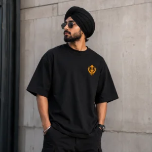Punjabi Sardar wearing black oversized t shirt with Kesari Khanda print