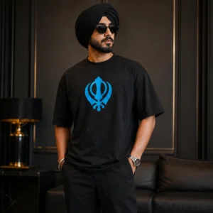Punjabi Sardar model wearing black oversized t shirt with blue Khanda symbol in luxury fashion style