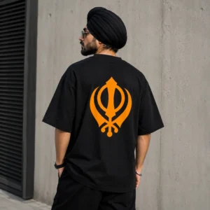 Punjabi Sardar wearing black oversized t shirt with Kesari Khanda back print