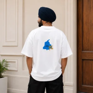 Punjabi man wearing white oversized t shirt with Punjab wheat back print design in 240 GSM French Terry fabric